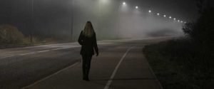 woman walking in dark